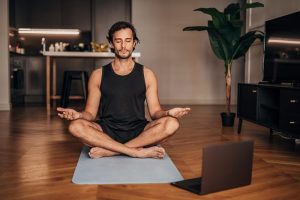 an image of a man meditating to signify the importance of meditating as a remote worker